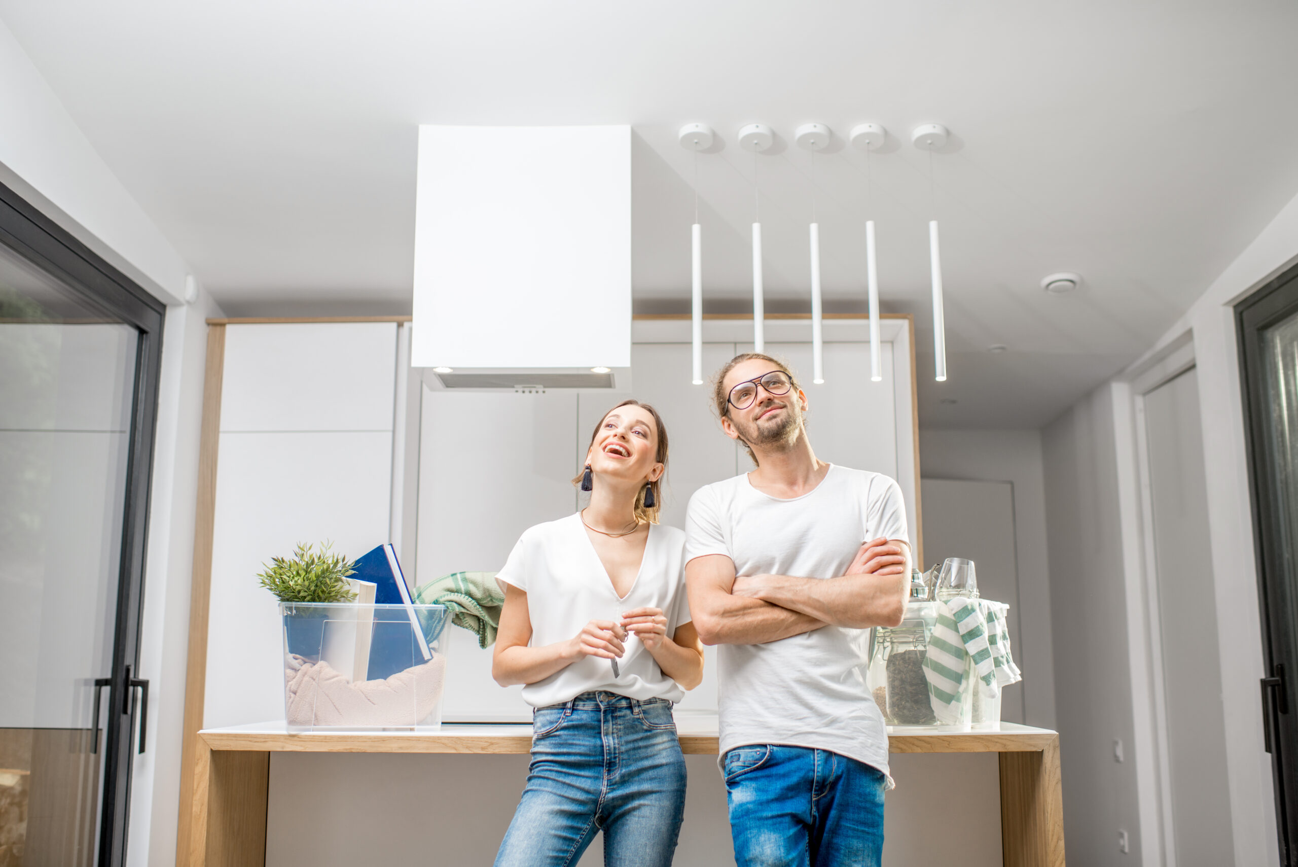 Young couple moving to a new modern house
